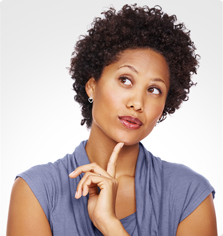 Woman with a finger on her chin looking to the side and contemplating something.