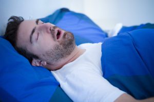 Man sleeping with his mouth happen