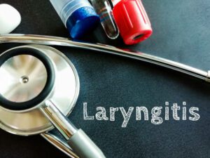 Laryngitis medical term with sthethoscope, An inflammation of vocal cord (larynx) from overuse, irritation or infection.