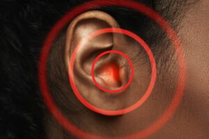 woman suffering with Tinnitus