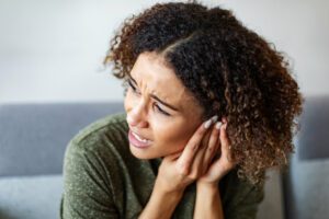 woman suffering with tinnitus