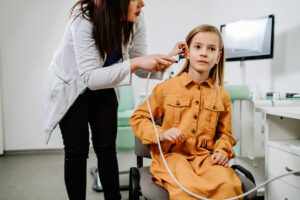 Medical hearing examination performed on a child.